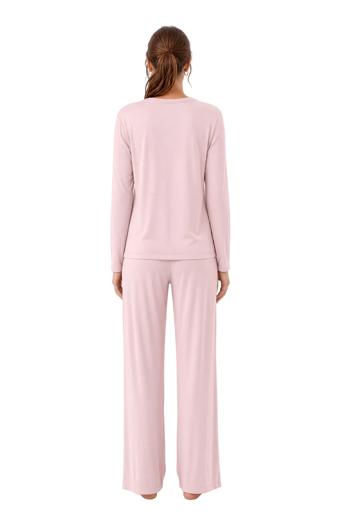 A woman viewed from the back wearing a light pink long-sleeve pajama top and matching wide-leg pants against a plain white studio background.